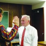 Mike Coster, Former White Pine County Commissioner swarn in by Ely Mayor Melody VanCamp. (photo credit Associated Press)